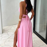 Elegant Wedding Guest maxi dress with halter neck and leg slit